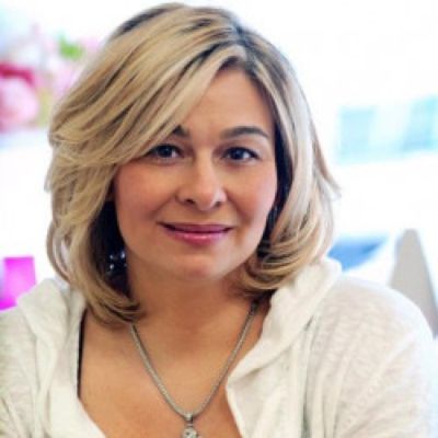 Photo of Mary Sciarrone smiling during a photo shoot. 